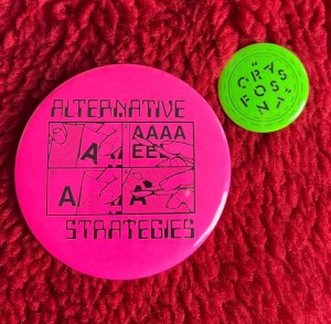Pink Alternative Strategies badge, green Crass Font badge